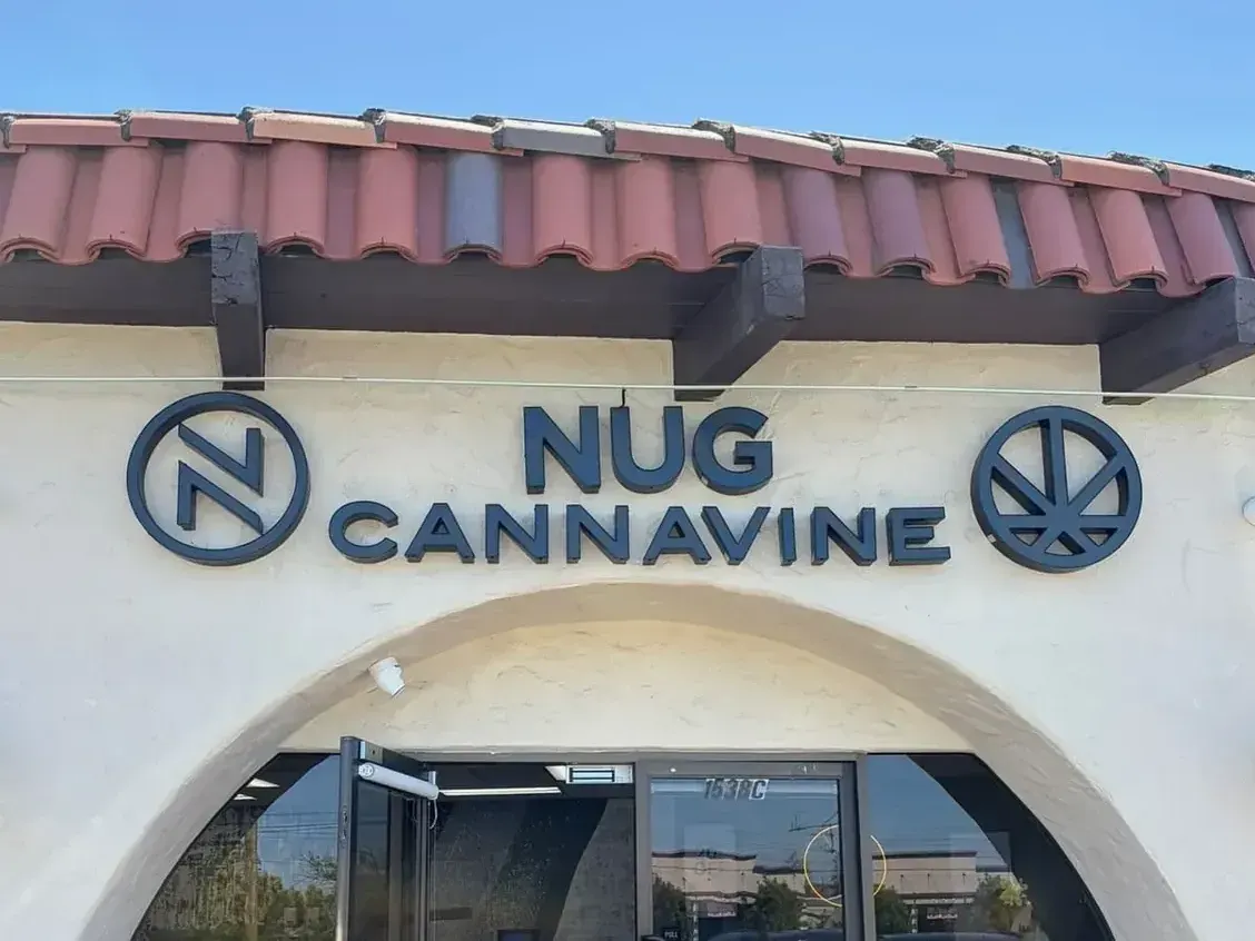 Nug Cannavine dispensary entrance with red tile roof and signage