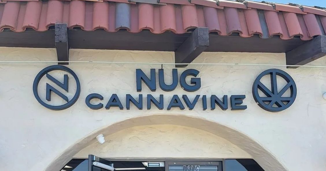 Nug Cannavine storefront sign with logo on Belmont building exterior